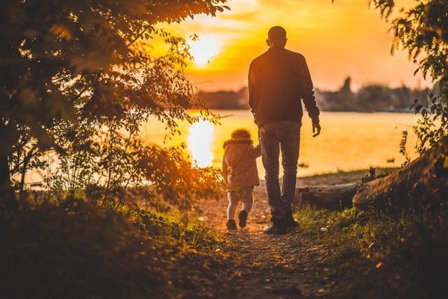 Family court lawyers father and young child holding hands the lighthouse project.