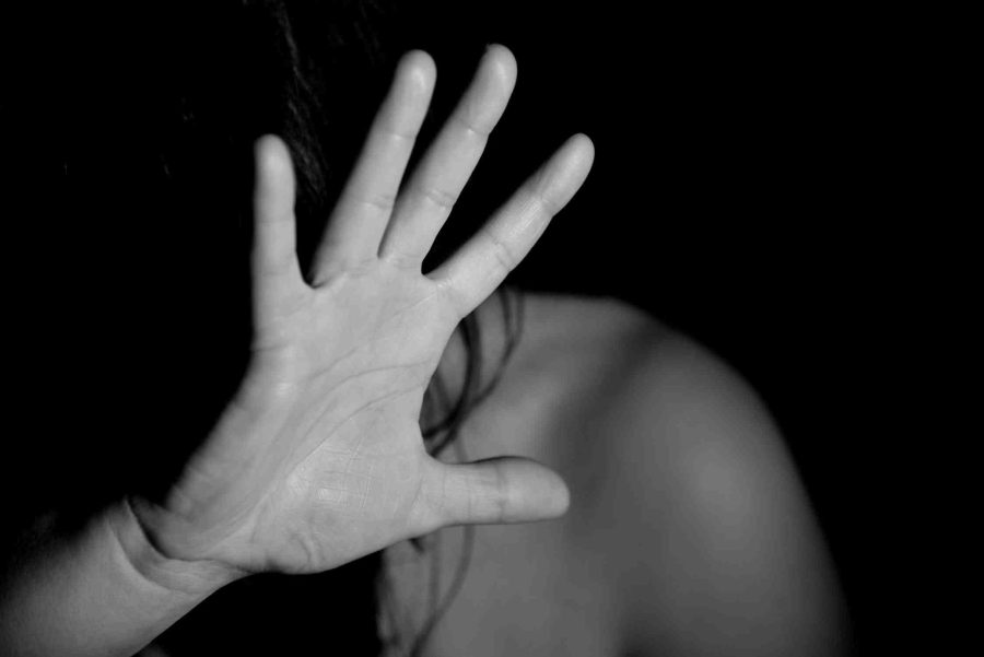 A hand outstretched in fear of domestic violence. Criminal and family lawyers in Adelaide.