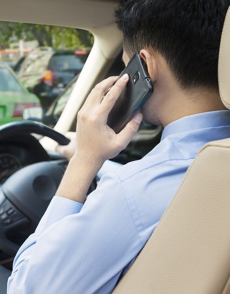 Traffic Lawyers Adelaide man talking on mobile phone while driving.